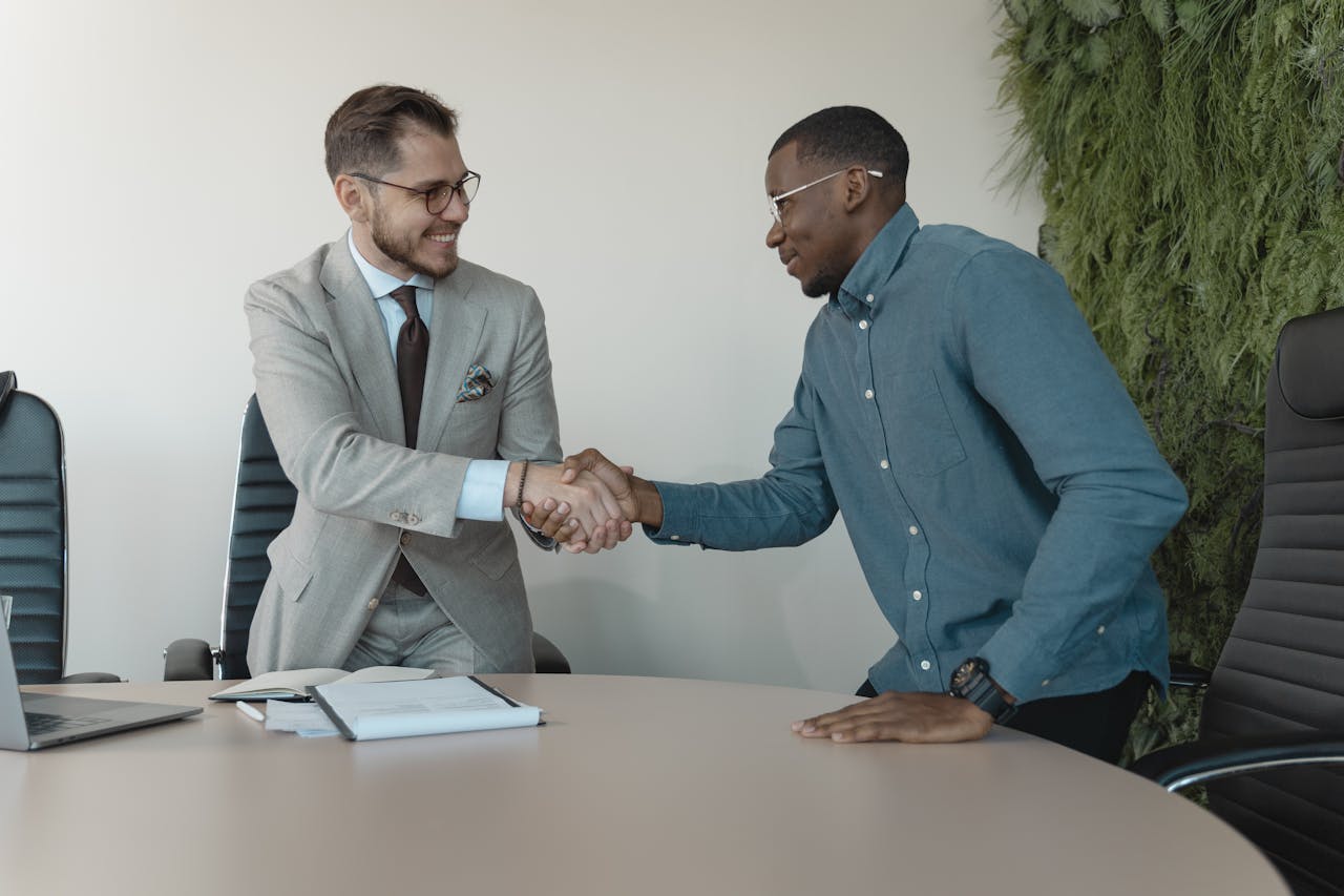 Man in Blue Long Sleeve Shirt Gets the Job